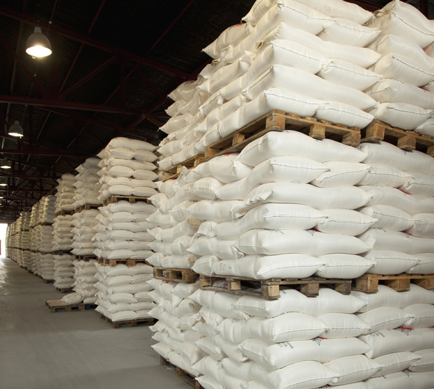 Bulk meat processing ingredients staged for industrial distribution